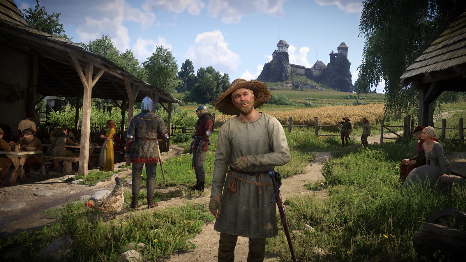 Kingdom Come: Deliverance II gameplay: làng quê với lâu đài trên đồi phía xa