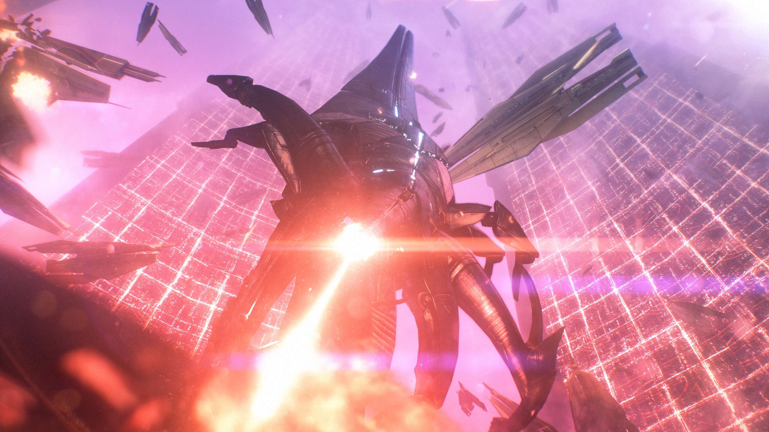 A towering Reaper fires a beam among spacecraft in Mass Effect Legendary Edition