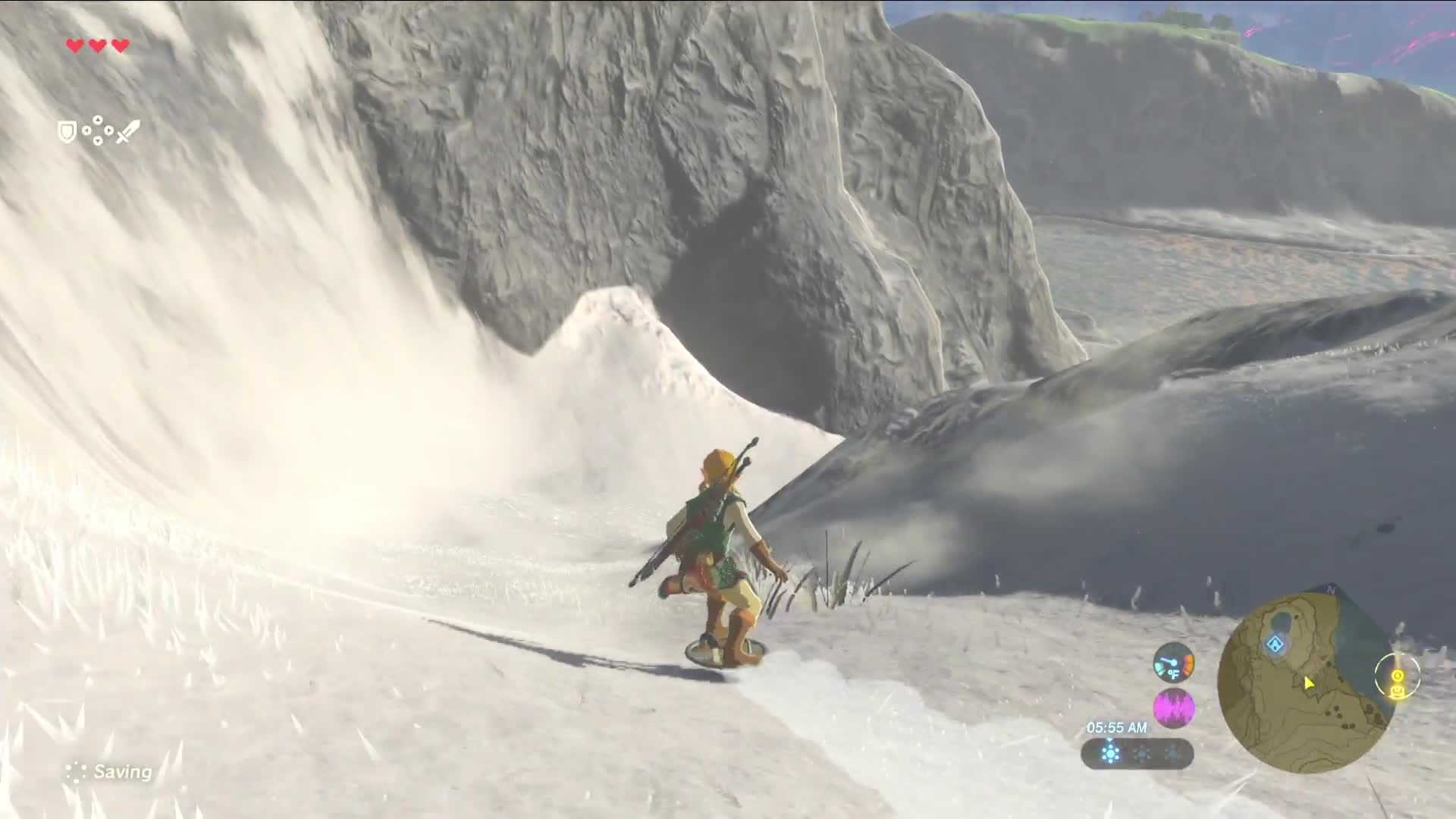 Link shield-surfs down a snowy slope in Breath of the Wild